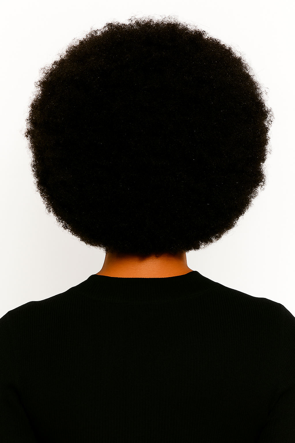 Back view of a person with voluminous natural afro hair showcasing Brazilian afro kinky hair bundles texture
